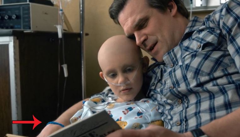  wearing his daughter's blue ribbon