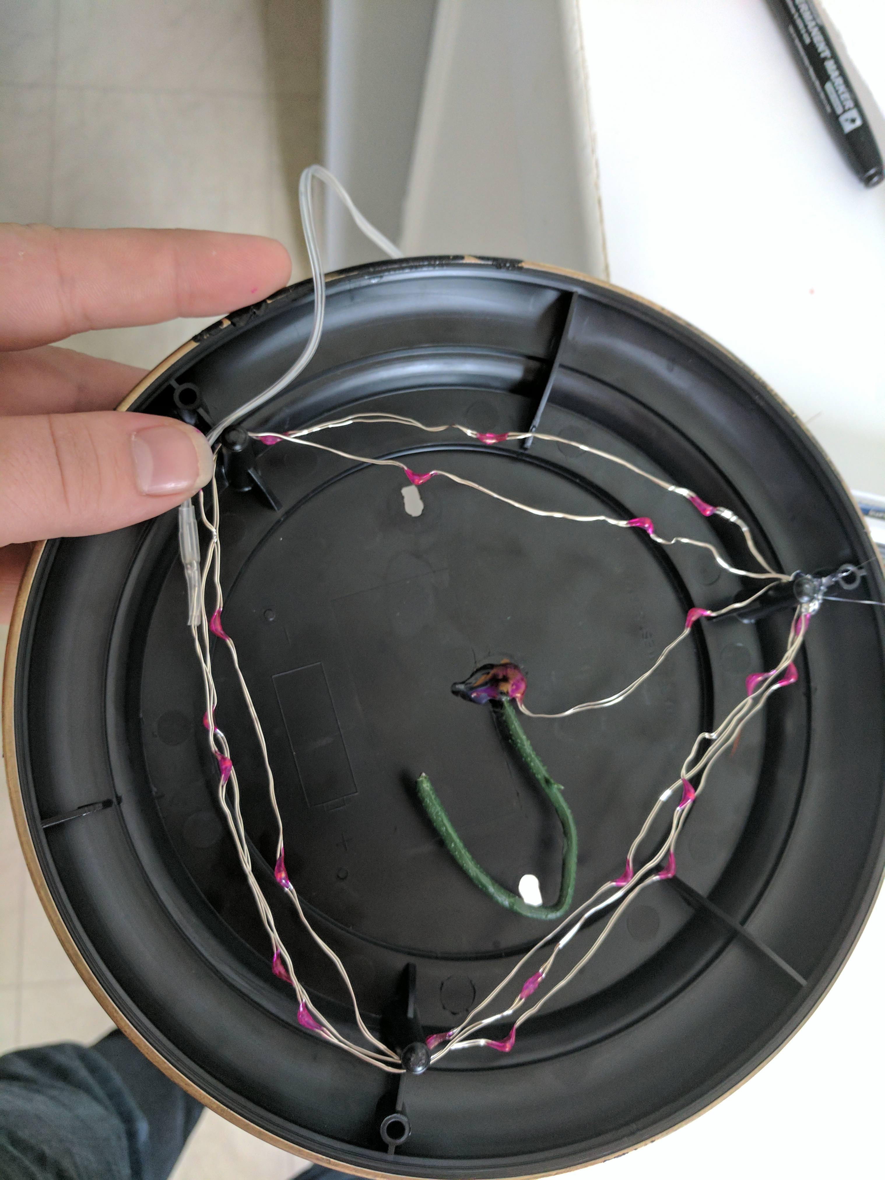 Wrapped the excess lights under the base